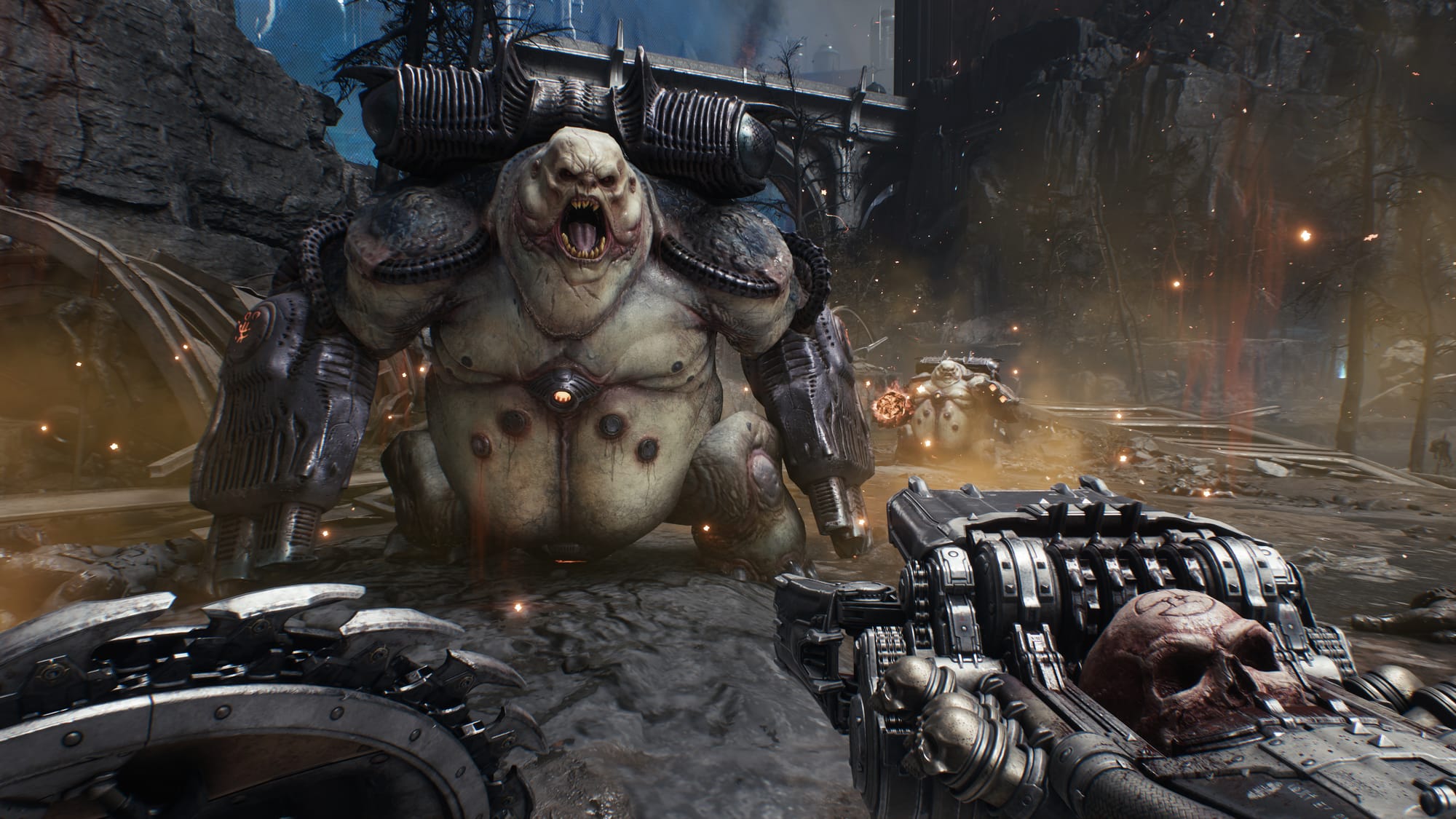 First-person view from Doom: The Dark Ages showing large armored demon boss enemy in medieval stone environment, with player's weapon visible in foreground