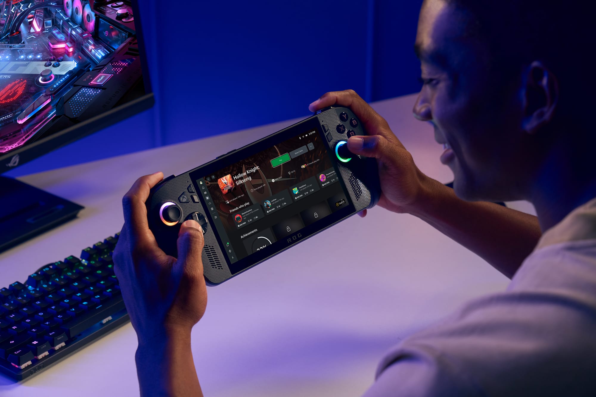 A person holding an Asus Xbox Ally X handheld gaming console.