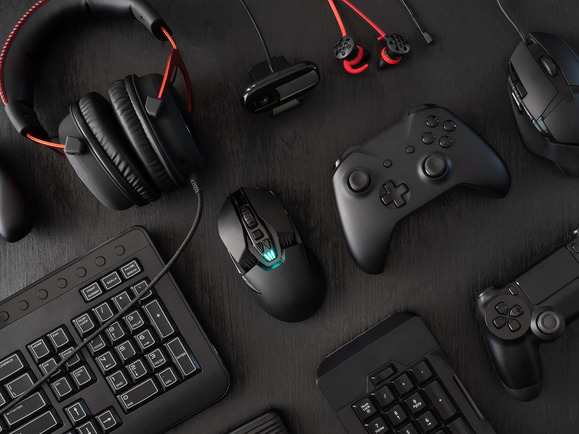 Gaming setup with controllers, headset, keyboard and mouse - essential equipment for silver gamers and gaming after 50