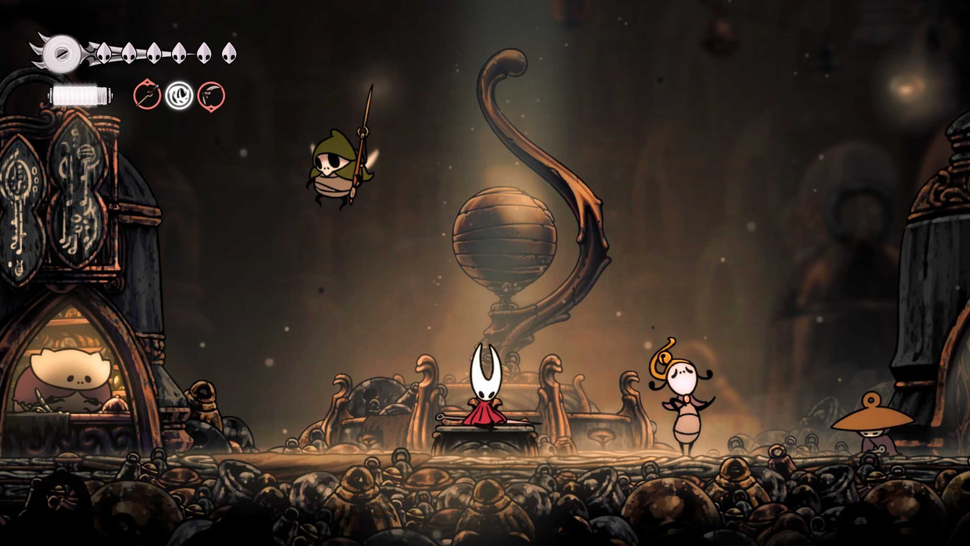 Hollow Knight Silksong screenshot showing Hornet meeting NPCs in atmospheric underground settlement with ornate architecture